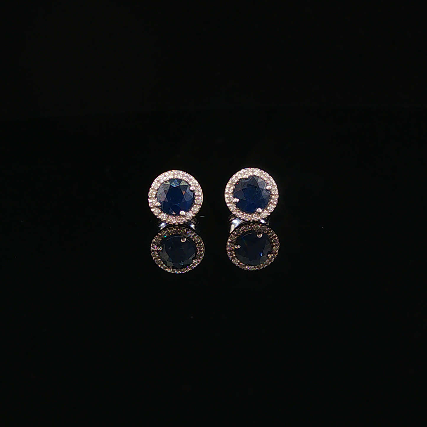 Deep Blue Sapphire Halo Stud Earrings in White Gold